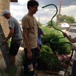 Mission Trip Painting, Cooling with a hose